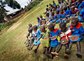 A group of school children eat a meal outside  their newly constructed kitchen at their school in Enchoro, Western Kenya on 19th February, 2009. Mary's Meals, a Scottish NGO, alongwith Tescoes supermarket sponsor each child at the school to have one 