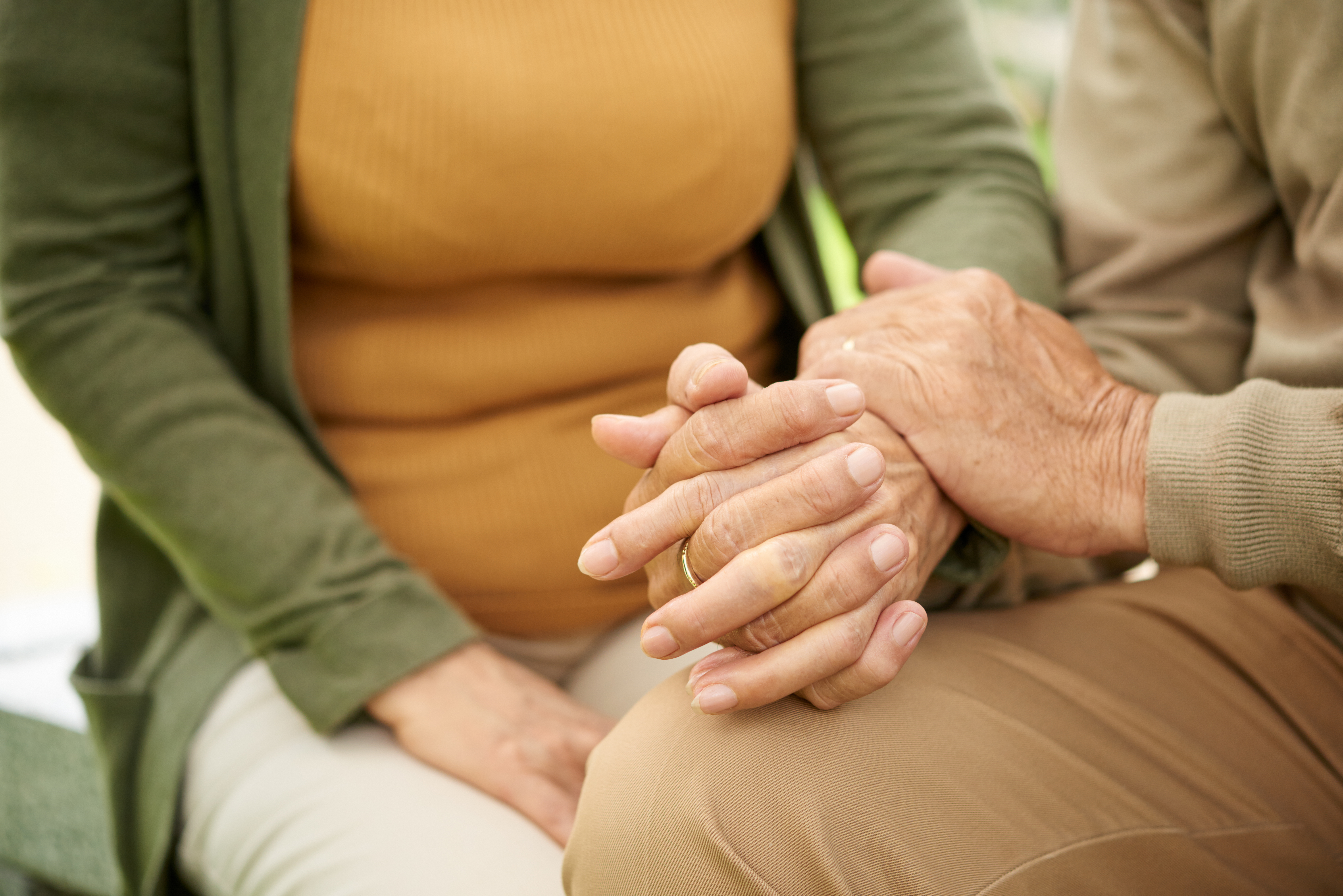 Close-up image of couple holding hands, support and love concept