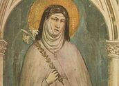https://it.wikipedia.org/wiki/Chiara_d%27Assisi#/media/File:Fresco_depicting_Clare_of_Assisi_holding_a_lily.jpg