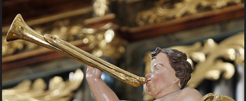 Posaune spielender Putto