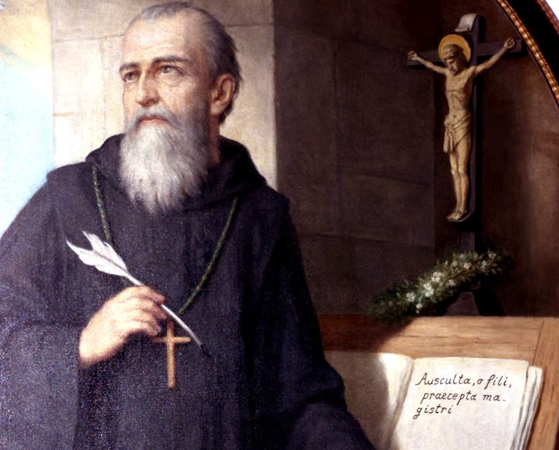 Hl. Benedikt v. Nursia, an der Ordensregel schreibend.