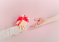 concept for christmas and new year event with beauty hand woman with winter cloth holding gift box and give or donate it to pauper person with isolated pink background