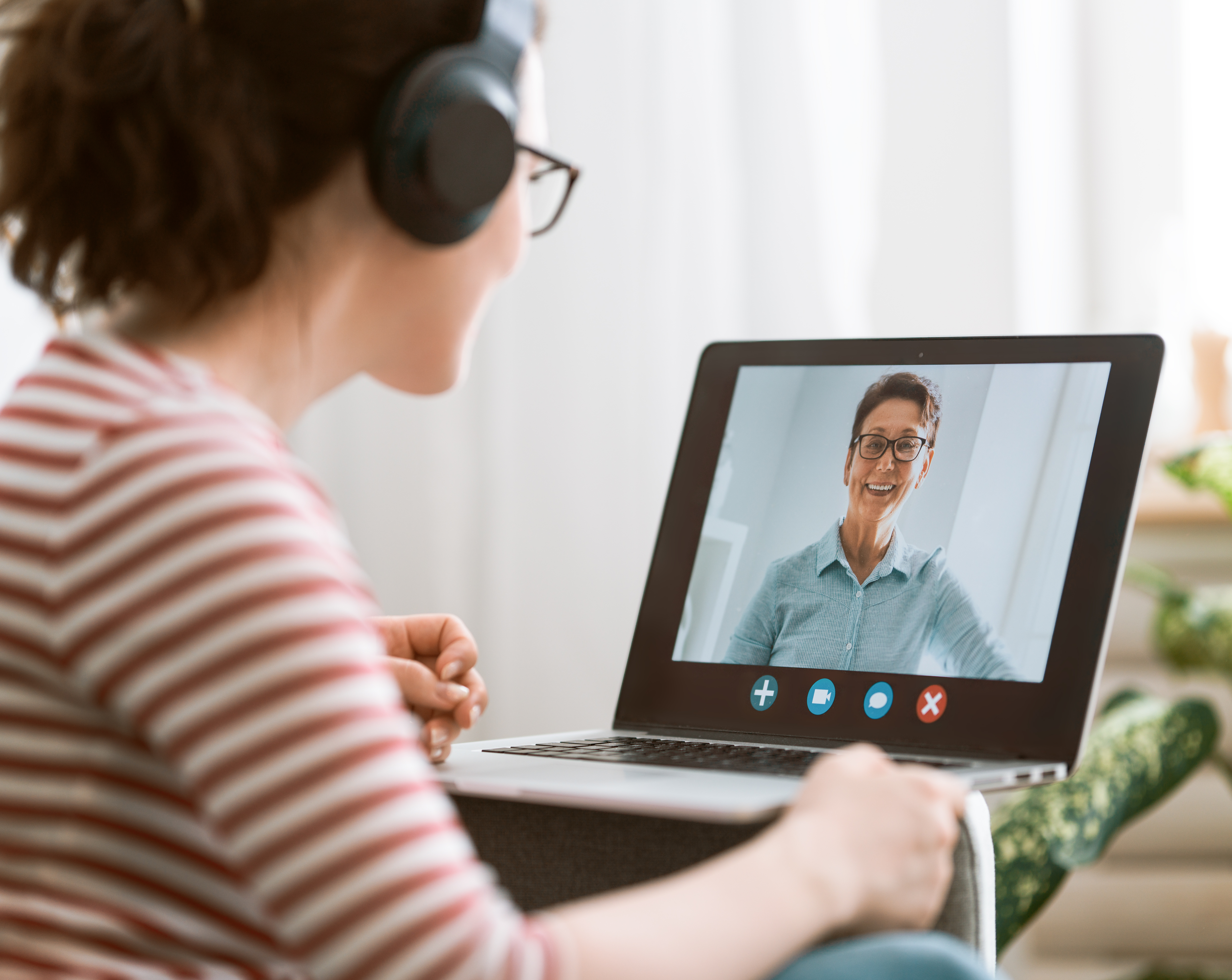 Young woman is using laptop pc for remote conversation and video call.