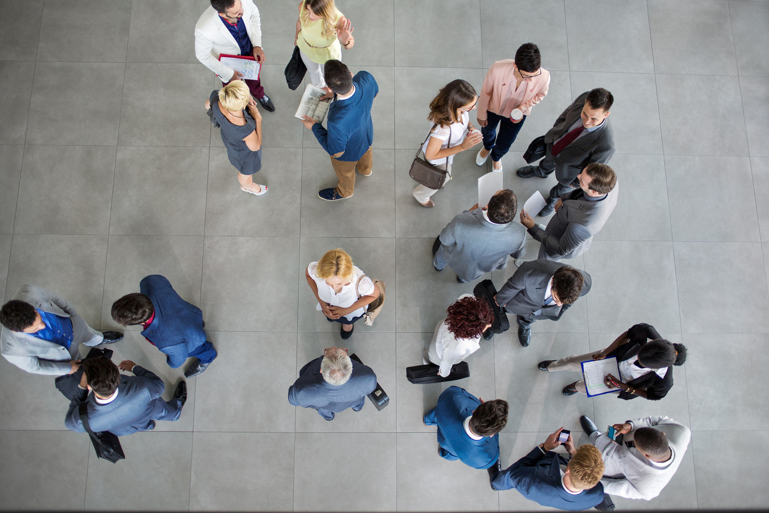 people standing and talking on business meeting in the group